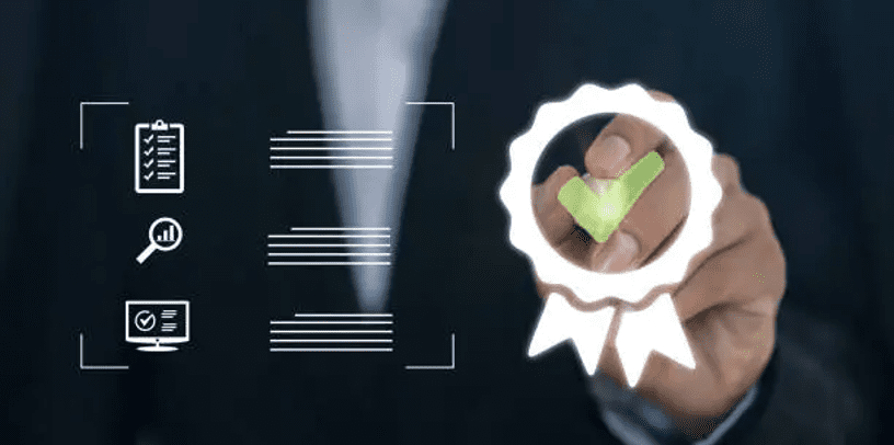 Hand holding a badge with a green checkmark symbolizing approval.